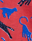 Close up display of red cat print shirt, fabric.