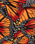 Close up display of butterfly print dress, fabric.