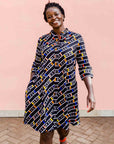 model wearing a multicolored and black striped dress
