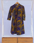 display of a gold and purple empire state building design dress