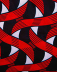 Display of red, black and white ribbon print dress.