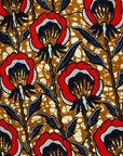 Display of mustard long sleeve blouse with red floral print.