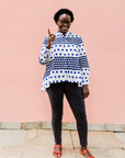 White shirt with blue and black yin yang dots