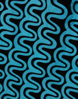 Close up display of blue and black squiggle print dress, fabric.