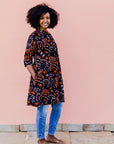 Black dress with orange and white small leaves