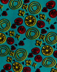 display of a green, red and yellow vegetable design dress