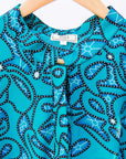 Display of blue squiggle print dress.