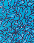 Close up display of blue squiggle print dress, fabric.
