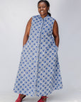 Model wearing blue and white mosaic print dress.