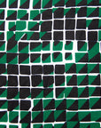Close up display of black, green and white geometric print dress