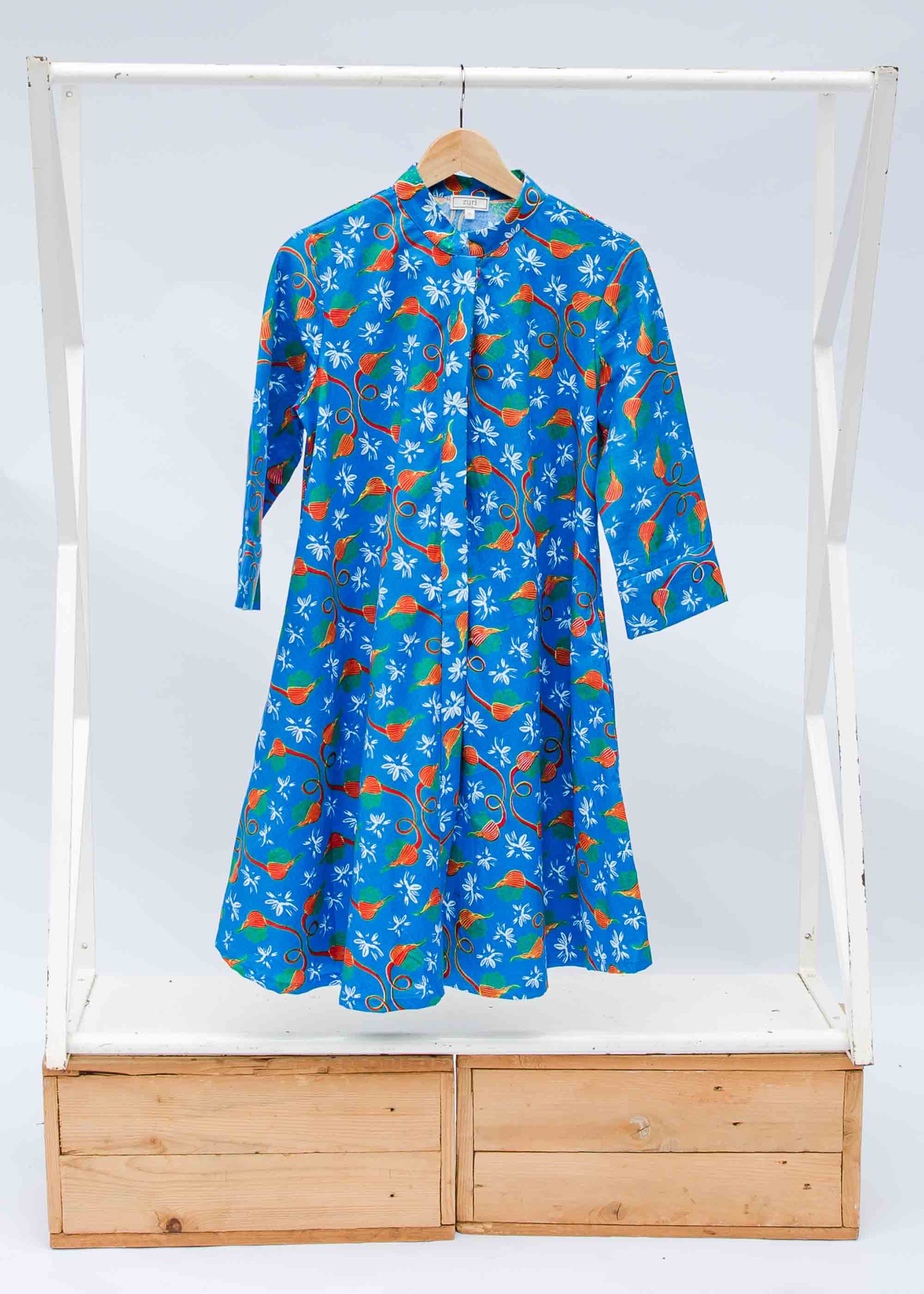 Display of a blue, red and white flower pod design shirt dress