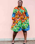 model wearing a rainbow swirl design dress