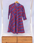 a blue, red and lavender geometric shirt dress