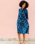 Navy background with blue, green and white dress