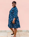 Navy background with blue, green and white dress