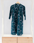 Navy background with blue, green and white dress