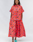 Model wearing red cat print shirt and culotte.