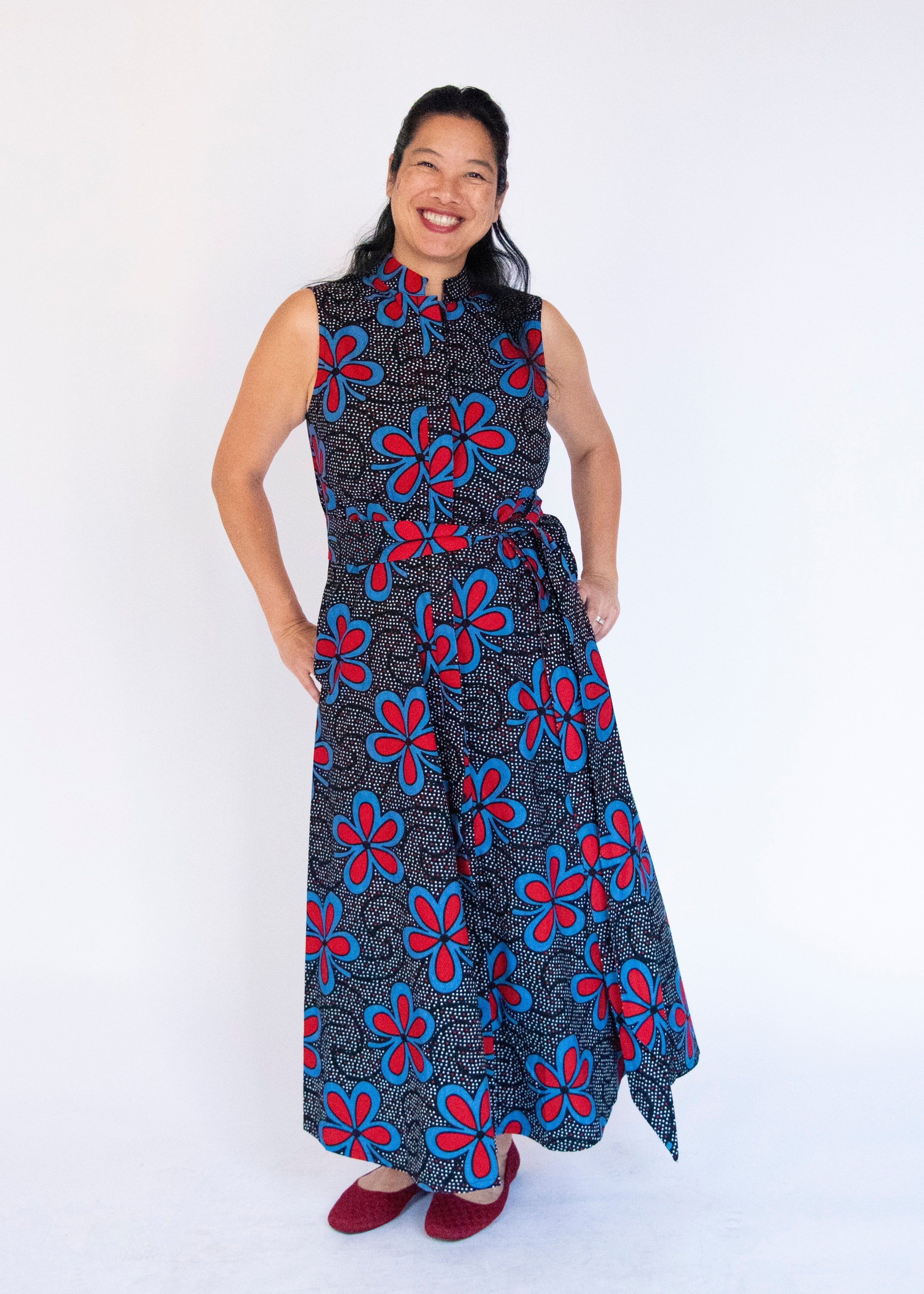 Model wearing floral print maxi dress.