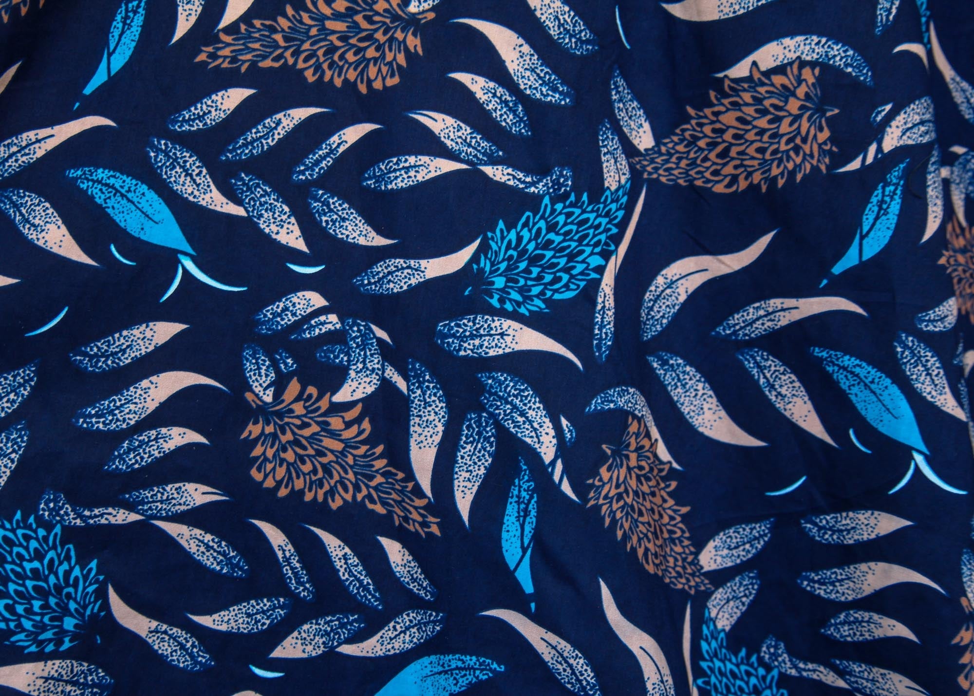 floral and leaf print on navy ground