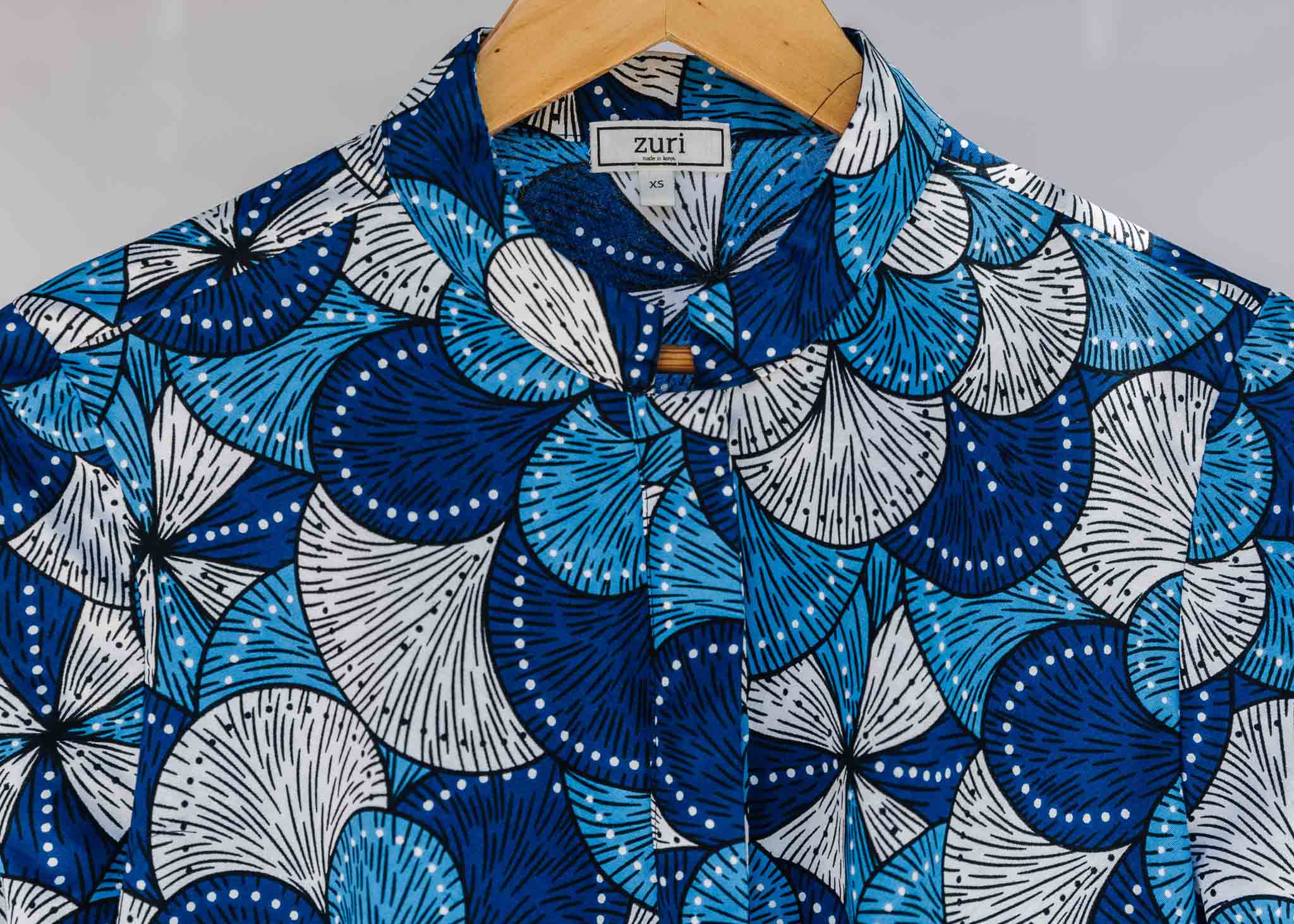 Display of blue and white floral print dress.