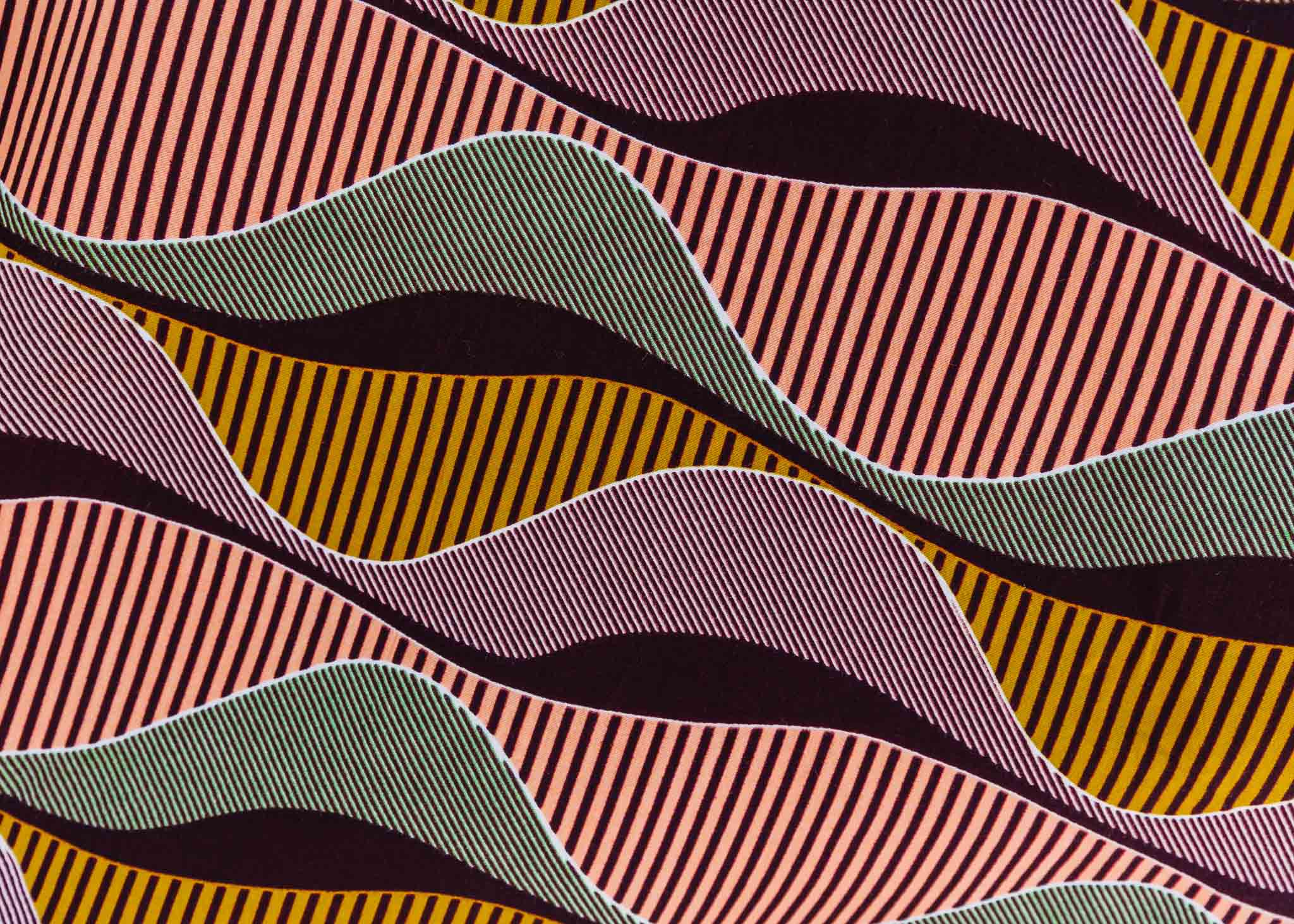 Display of neutral color geometric print dress.