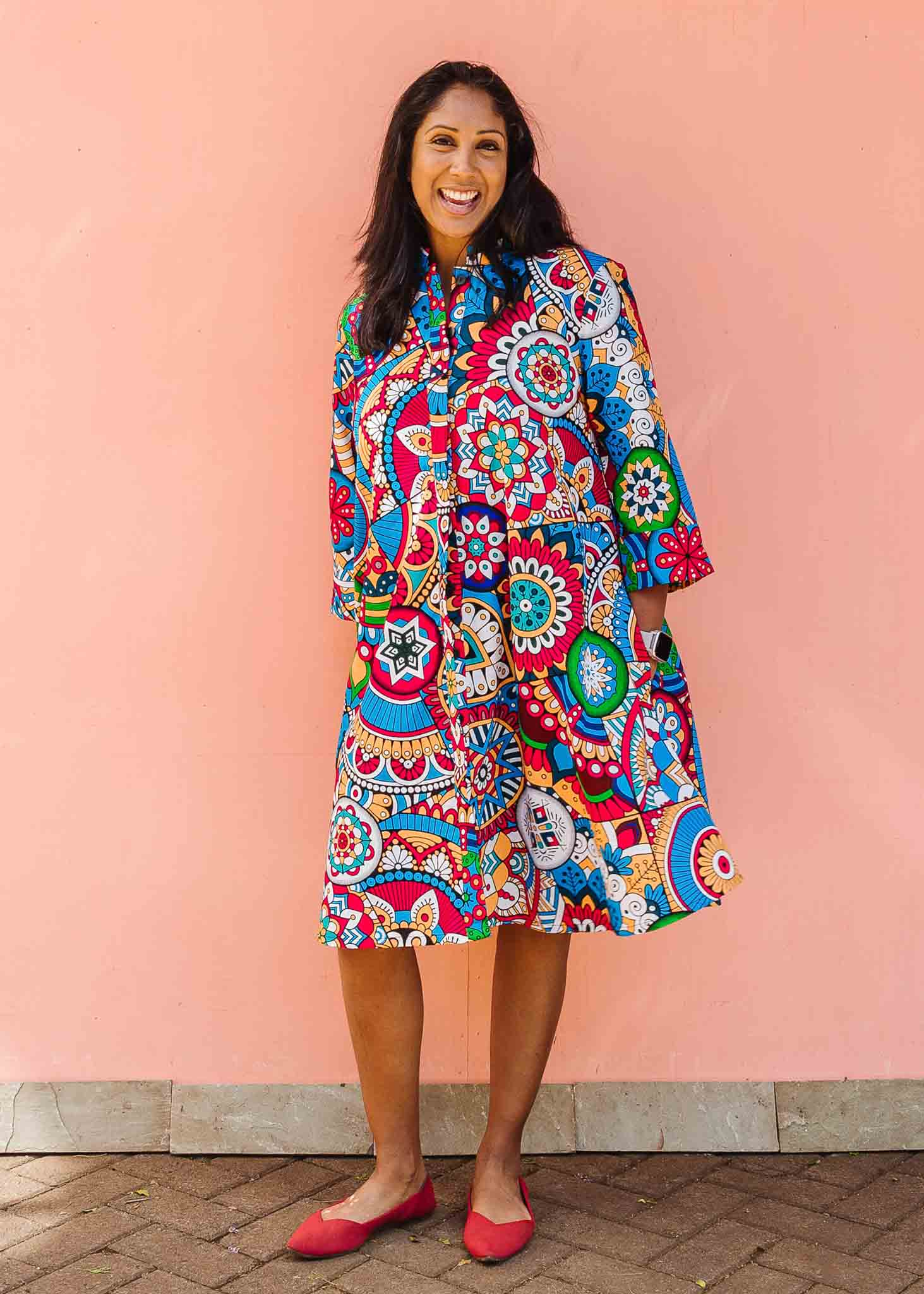 Model wearing rainbow mosaic print dress.