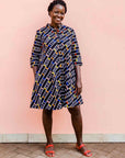 model wearing a multicolored and black striped dress