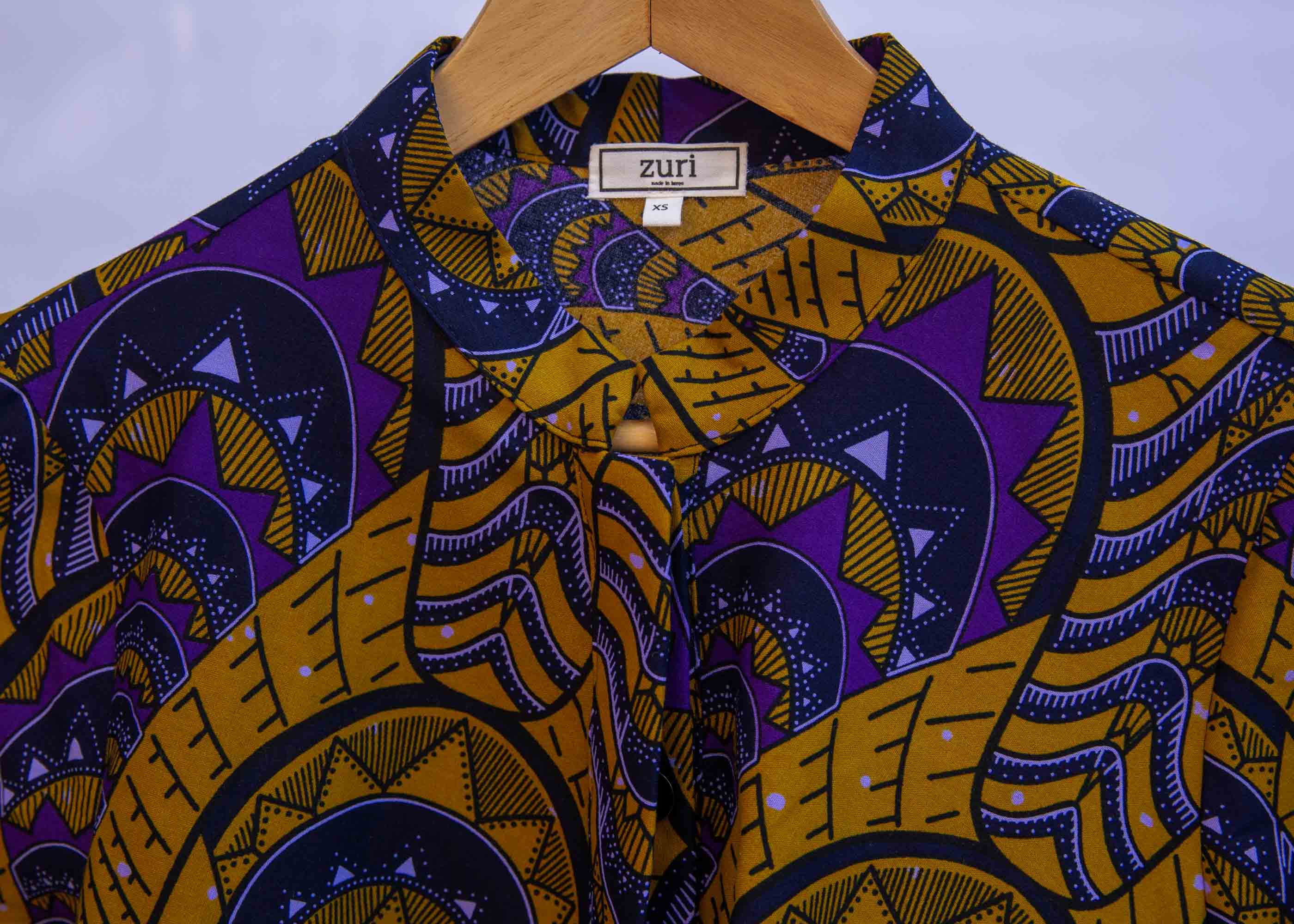 display of a gold and purple empire state building design dress
