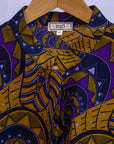 display of a gold and purple empire state building design dress