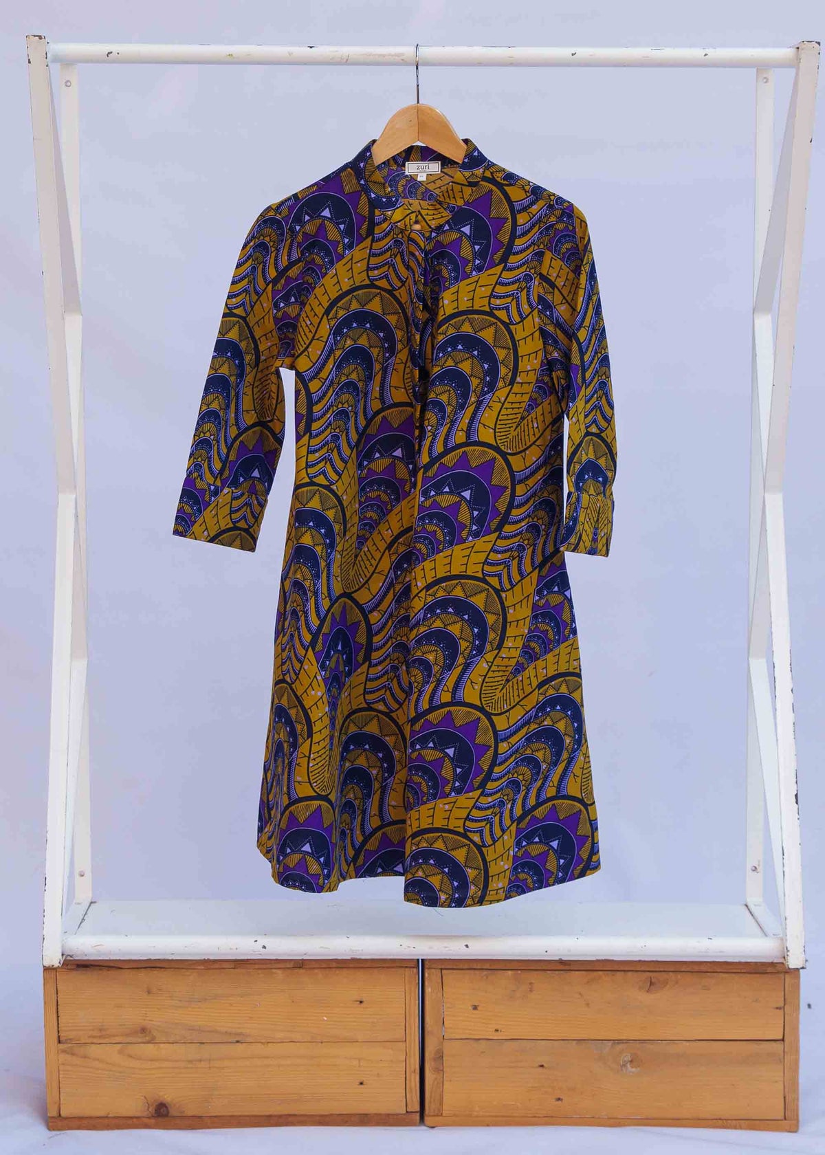 display of a gold and purple empire state building design dress