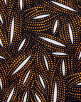 Display of a brown, black and white seed design dress