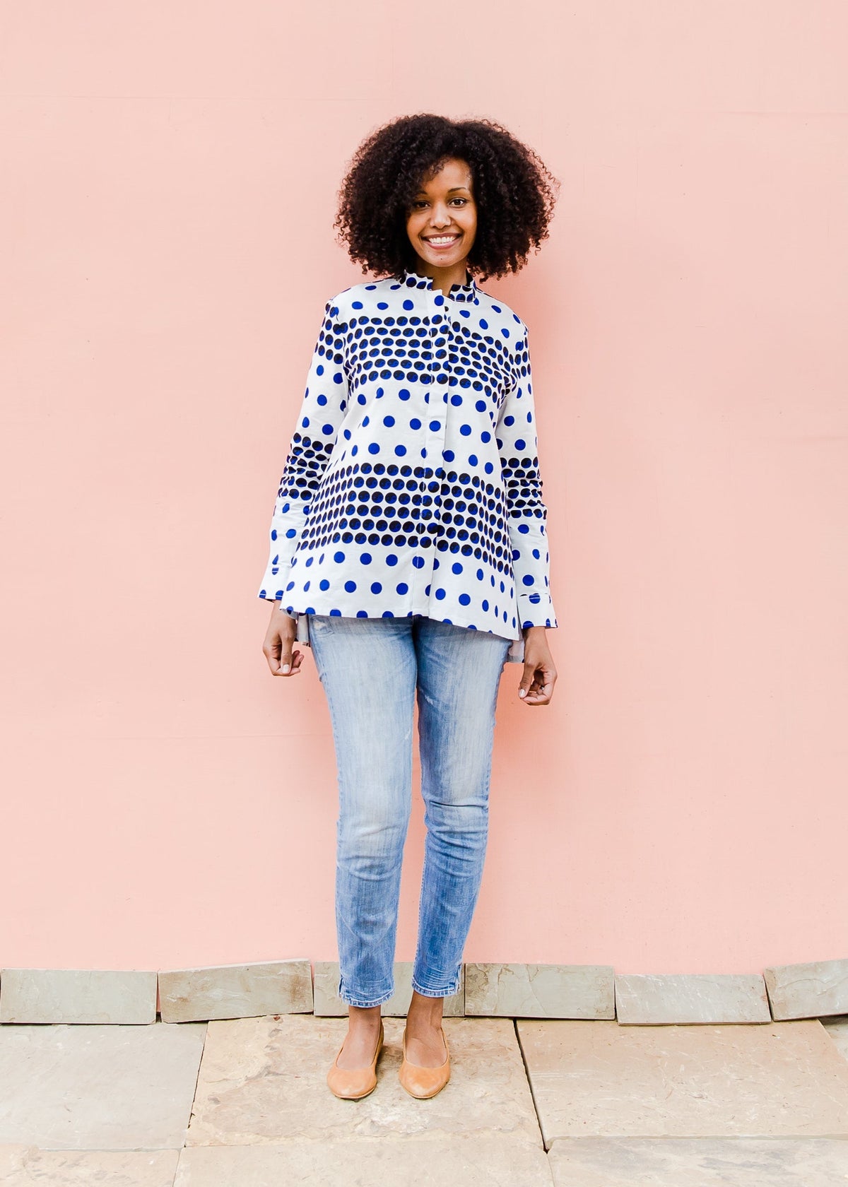 White shirt with blue and black yin yang dots