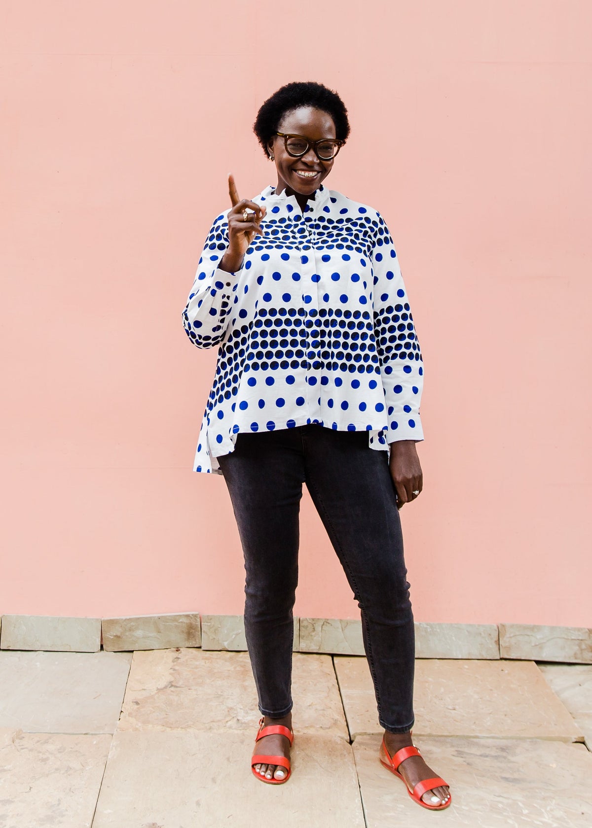 White shirt with blue and black yin yang dots
