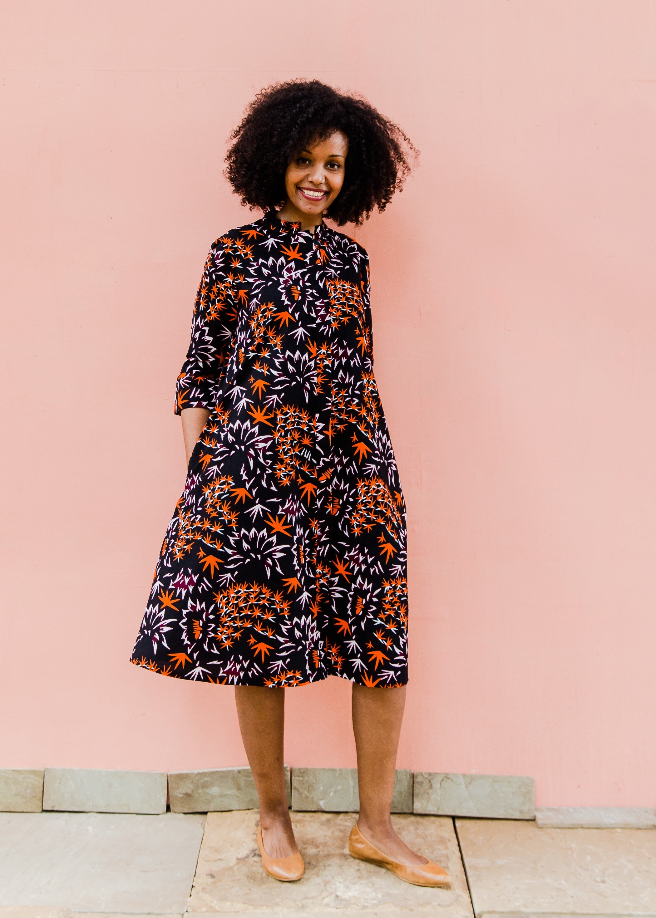 Black dress with orange and white small leaves