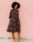 Black dress with orange and white small leaves