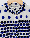 White shirt with blue and black yin yang dots