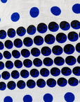 White shirt with blue and black yin yang dots