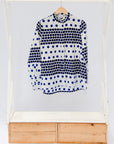 White shirt with blue and black yin yang dots