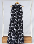 Display of black and white floral print, sleeveless dress.