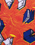 Close up display of yellow and red, blue book print dress.