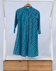 Display of blue and black squiggle print dress.