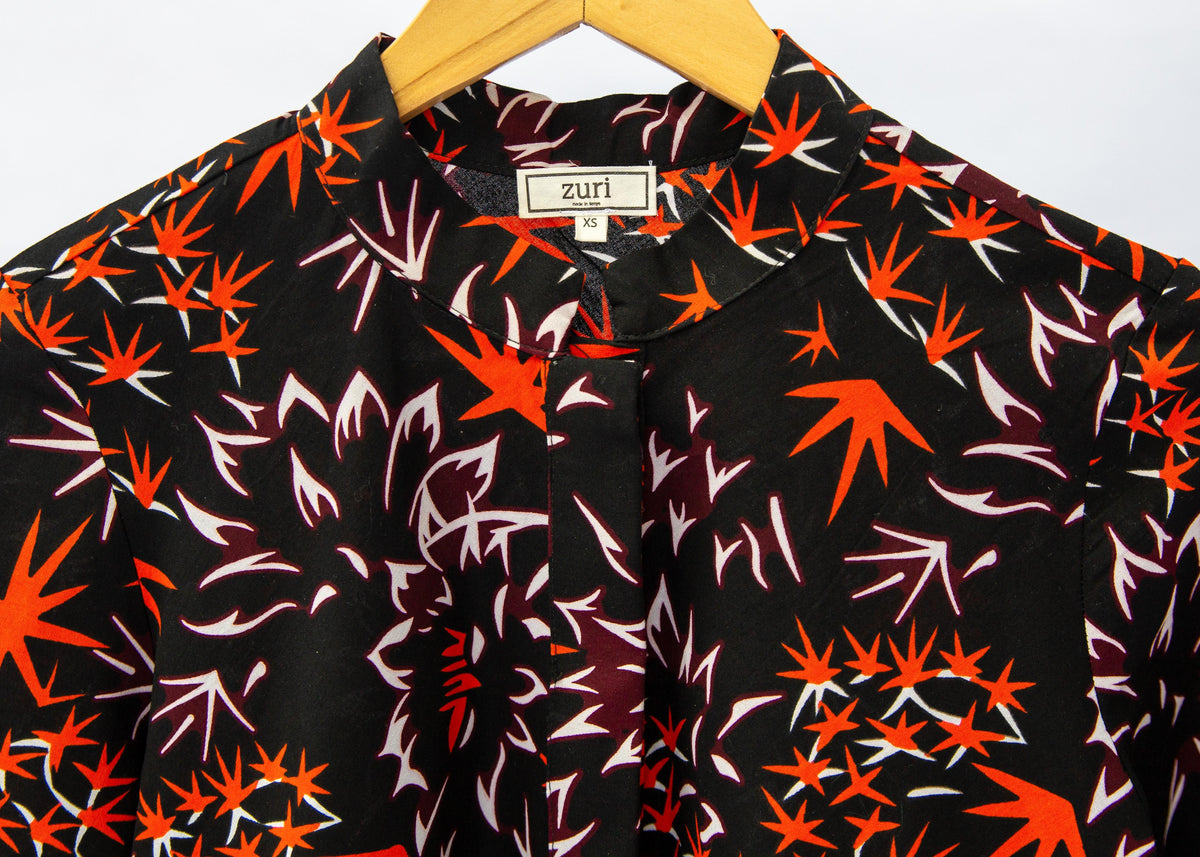Black dress with orange and white small leaves