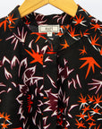 Black dress with orange and white small leaves