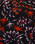 Black dress with orange and white small leaves