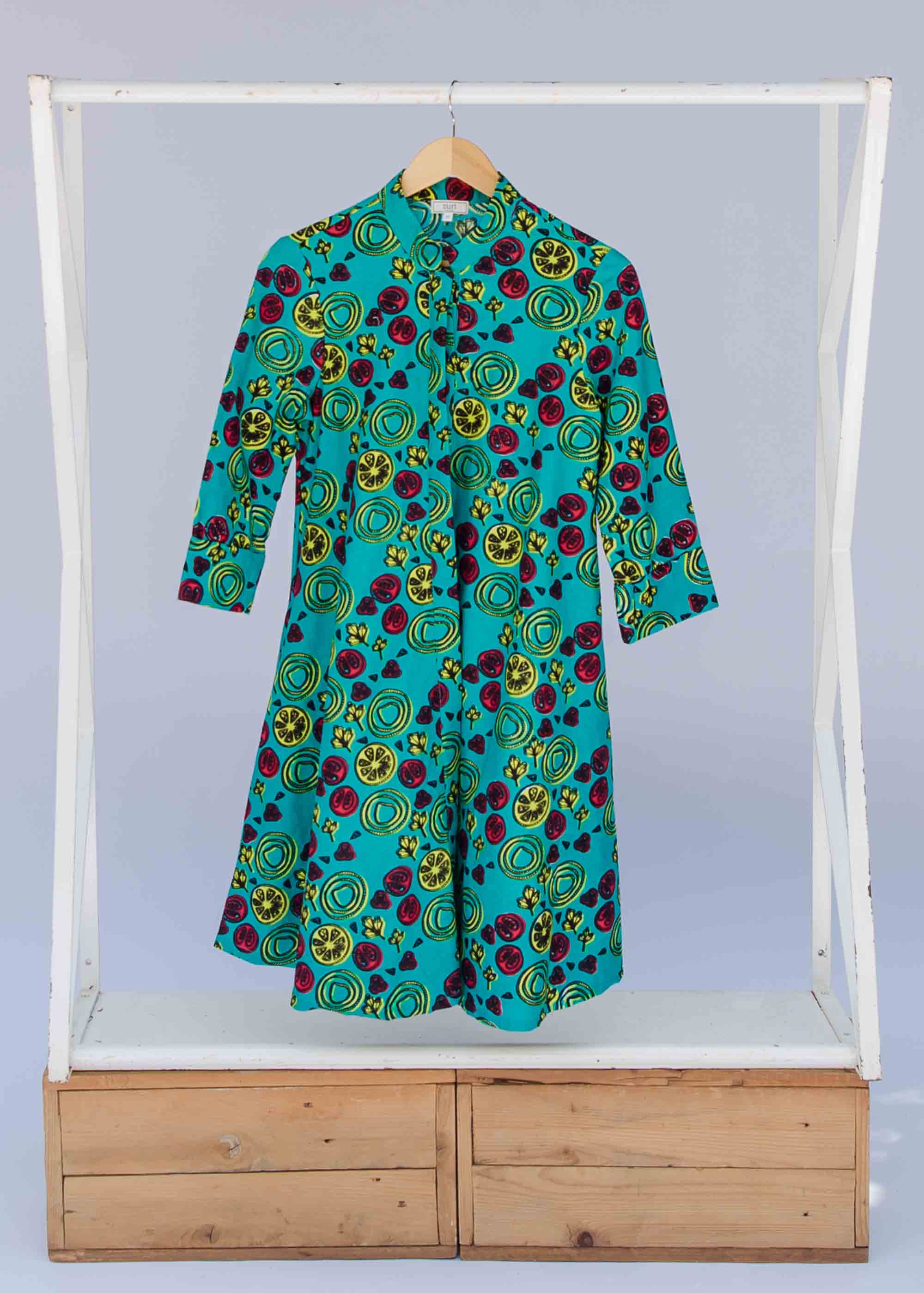 display of a green, red and yellow vegetable design dress