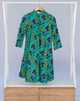 display of a green, red and yellow vegetable design dress