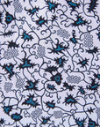 Display of white sleeveless dress with blue floral print.