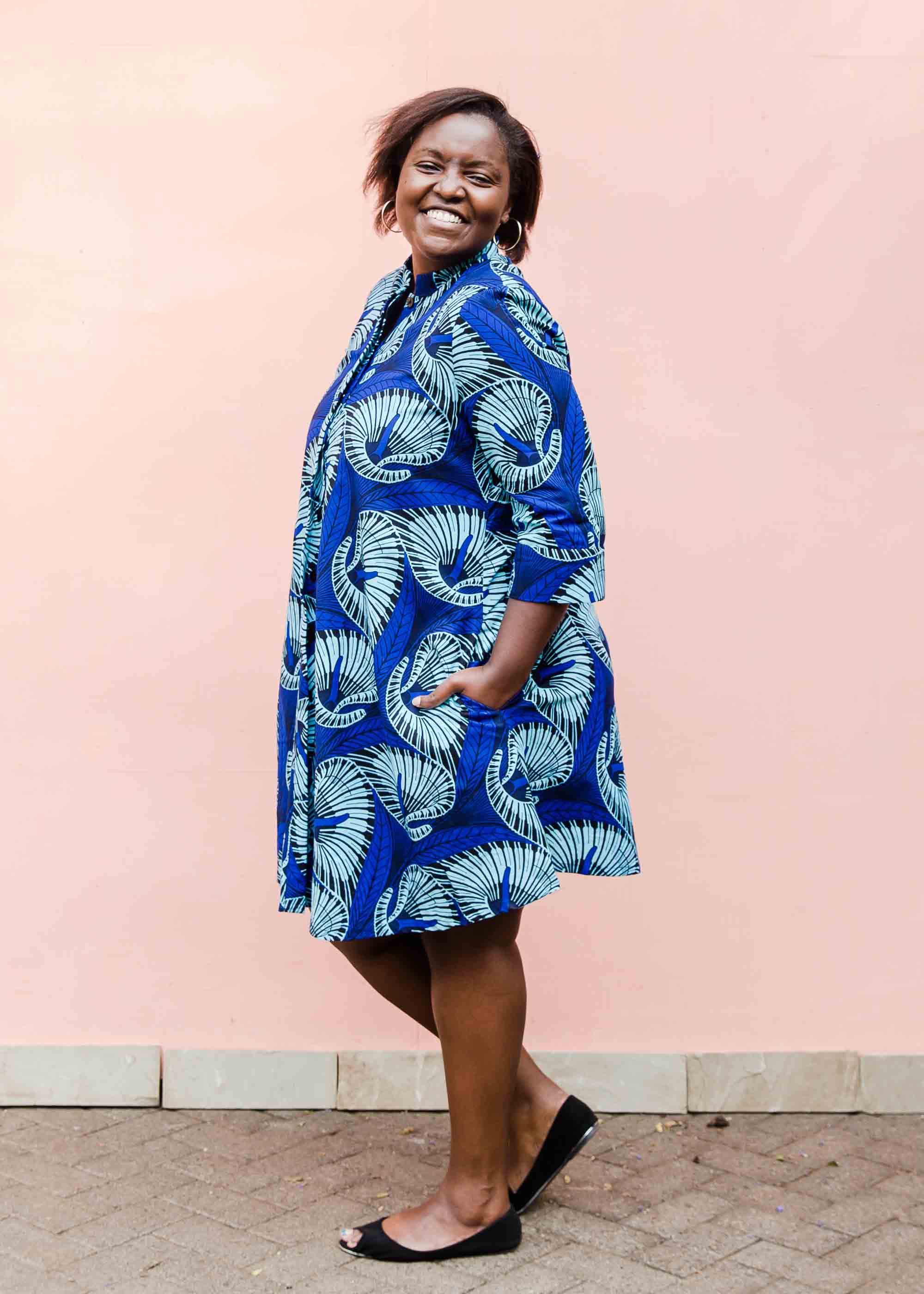model wearing a blue lily design dress