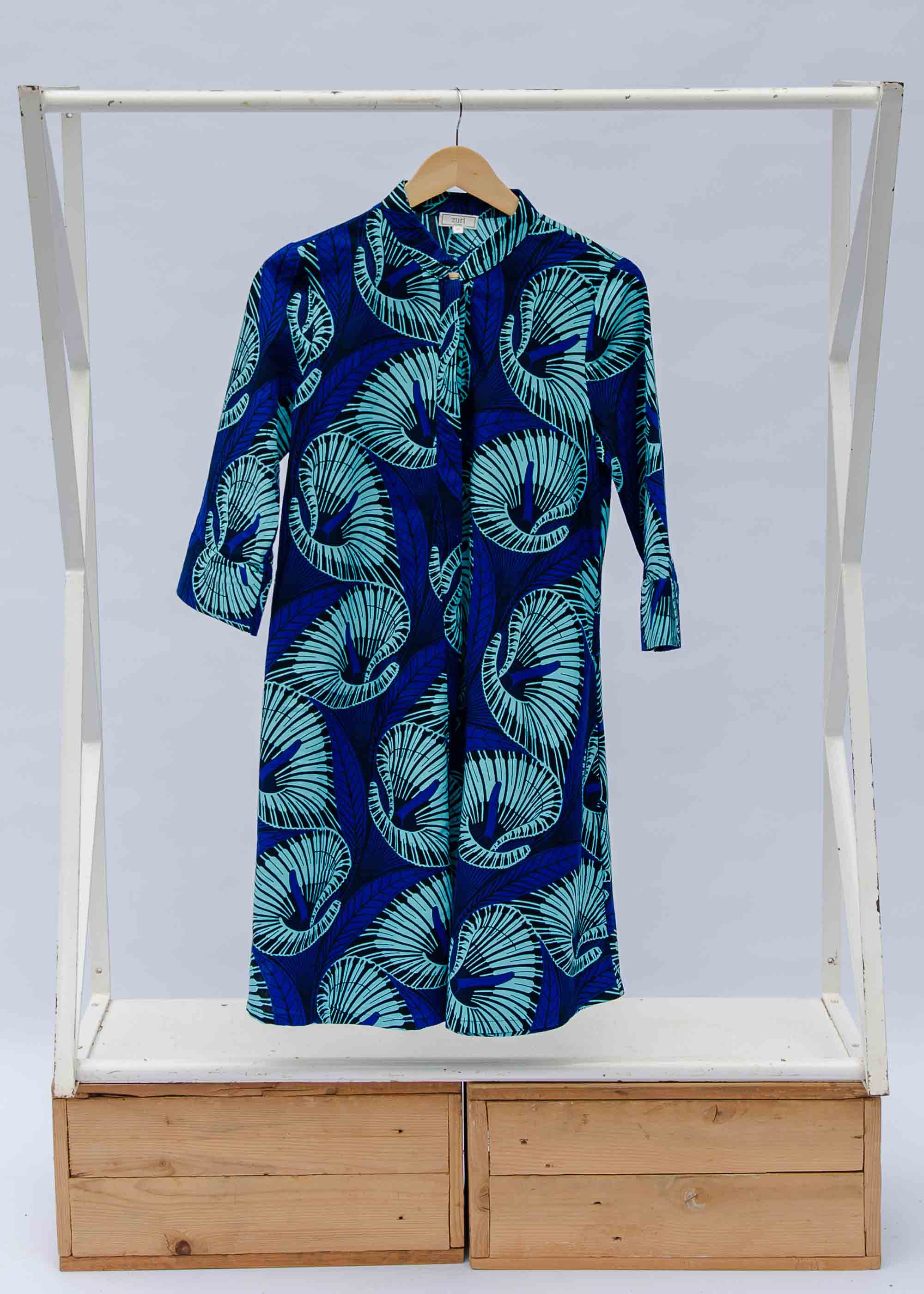 Display of a blue lily design dress