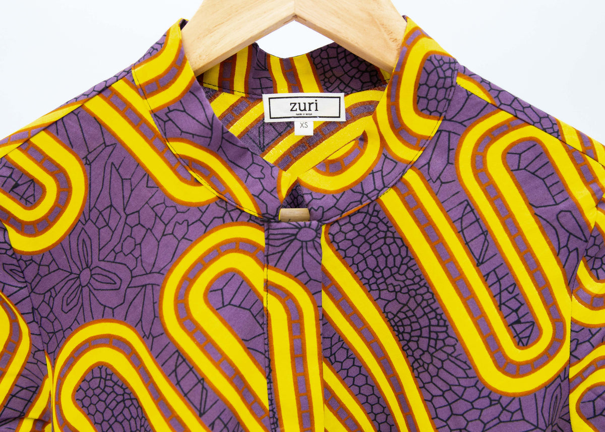 Purple dress with yellow squiggles